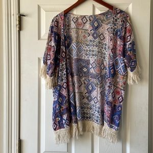 Multi colored cardigan with fringe.Pet free smoke free home.